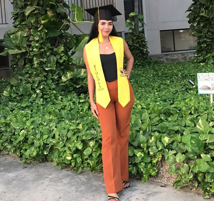 Darlis Gamarra standing outdoors in graduation attire